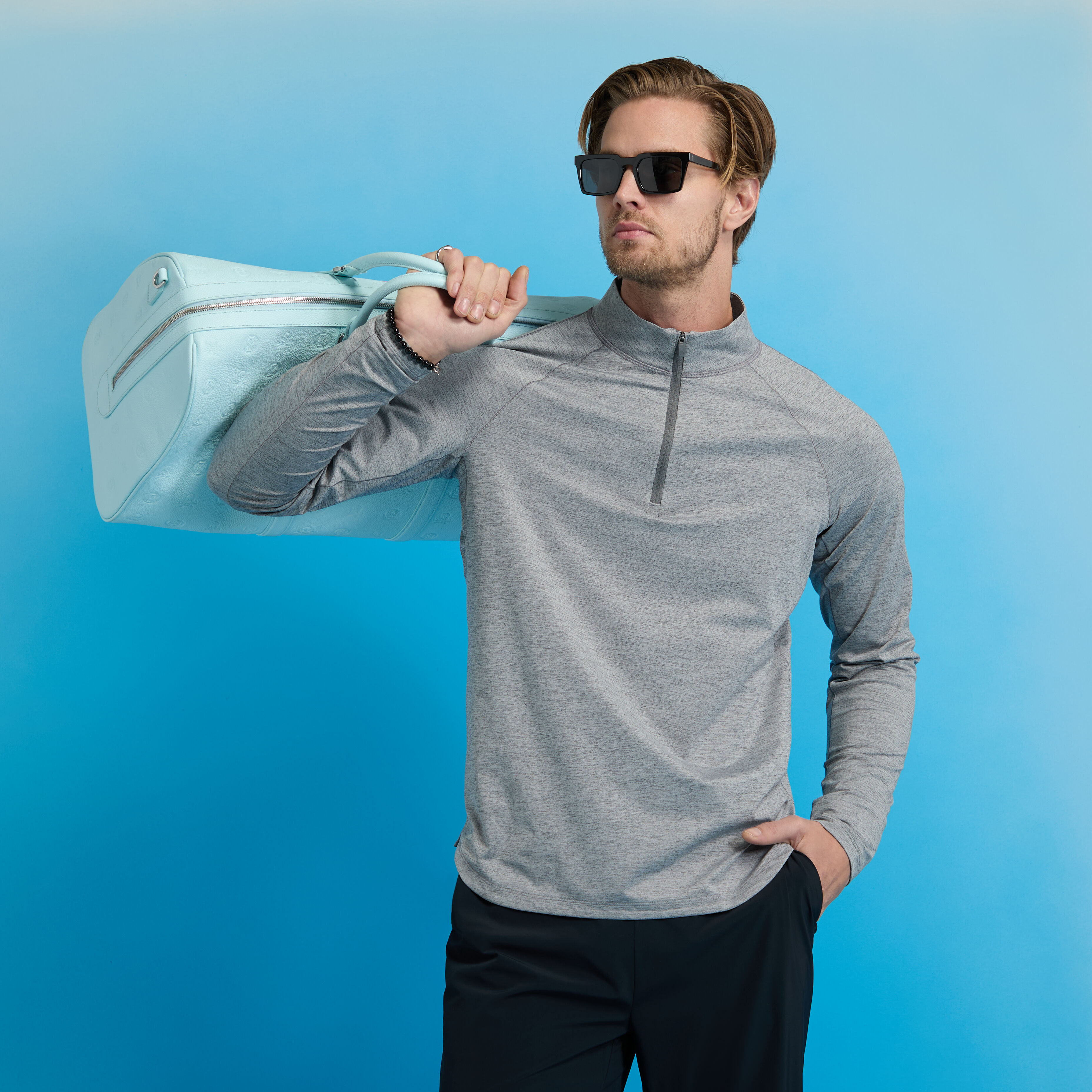 TECH MÉLANGE RAGLAN QUARTER ZIP PULLOVER