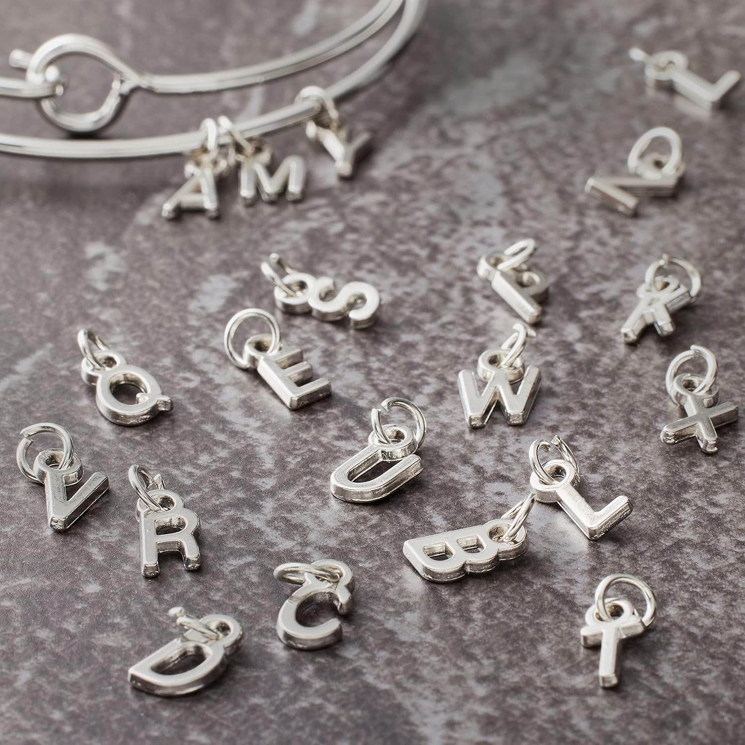 Bead Landing 12 Packs: 26 ct. (312 total) Mini Rhodium-Colored Alphabet Capitals Charms