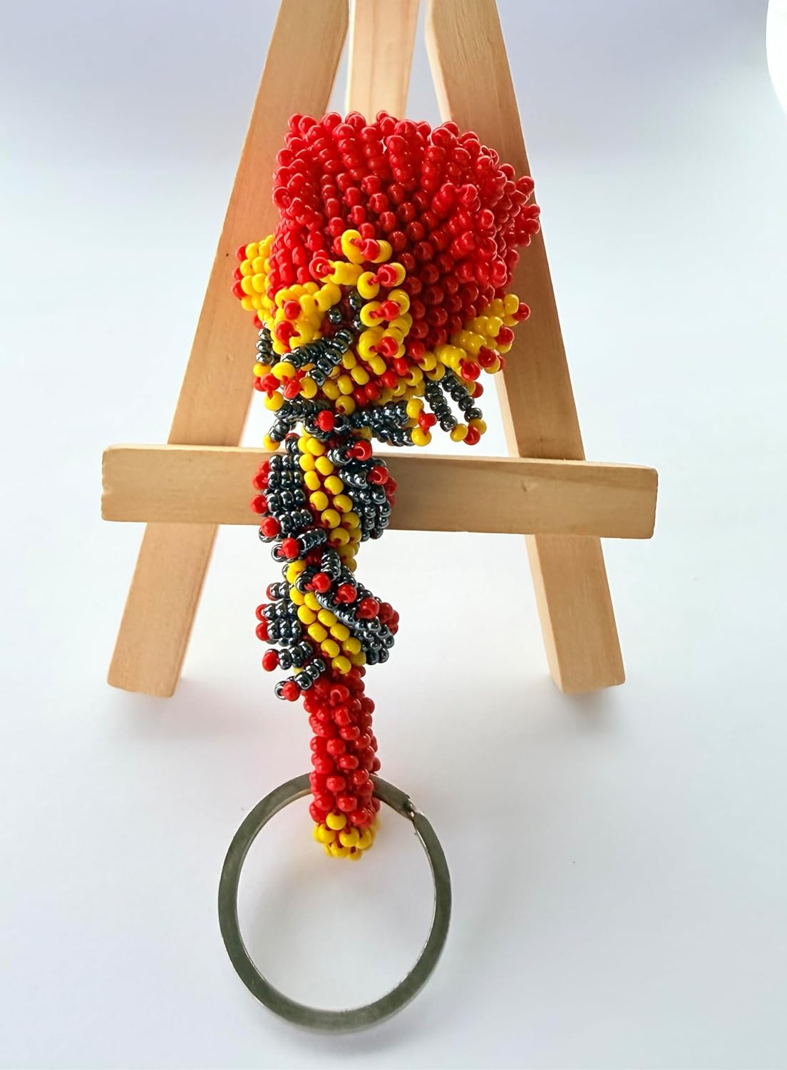 vibrant mix of red, yellow, and black glass beads woven