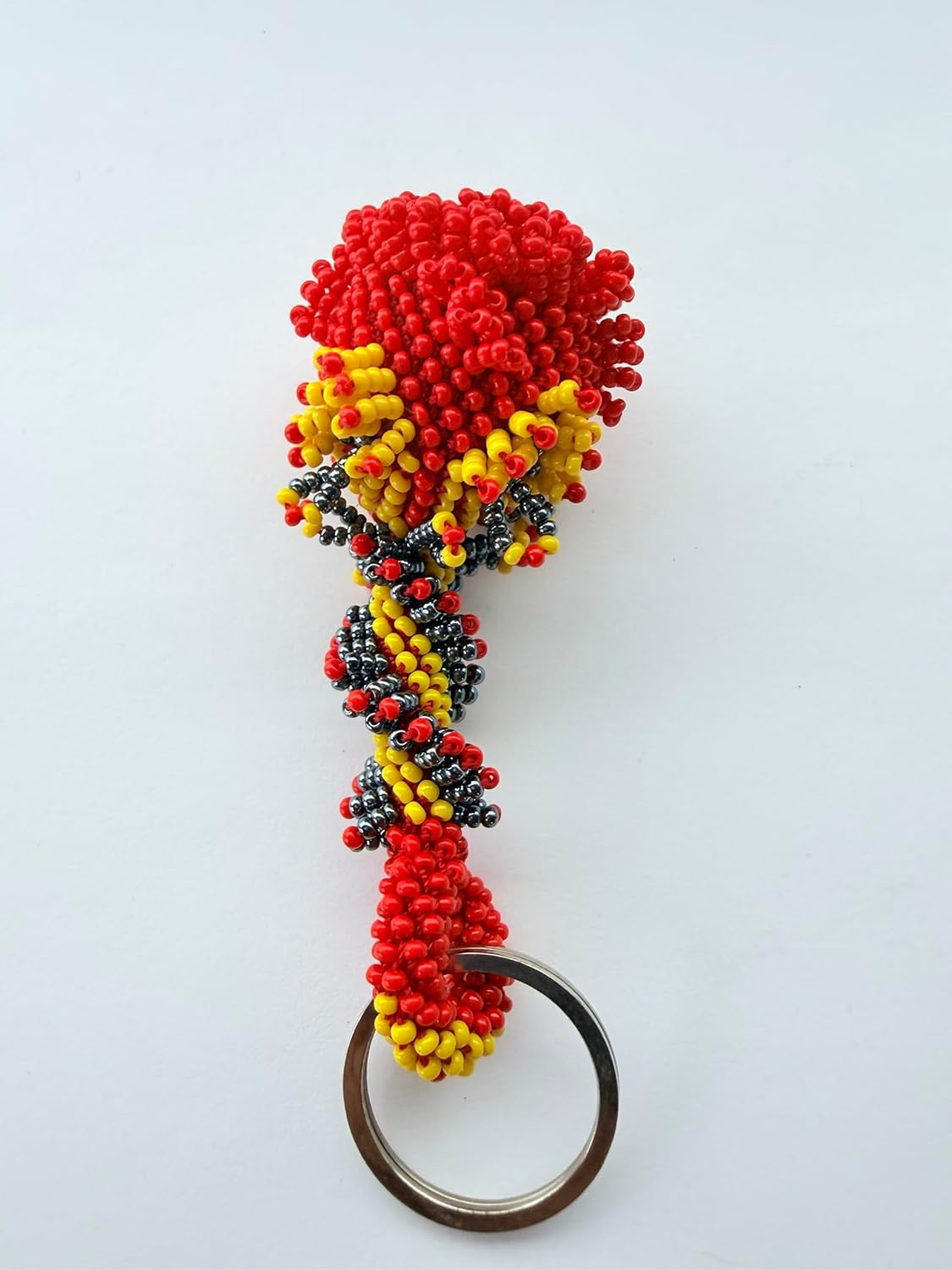 vibrant mix of red, yellow, and black glass beads woven