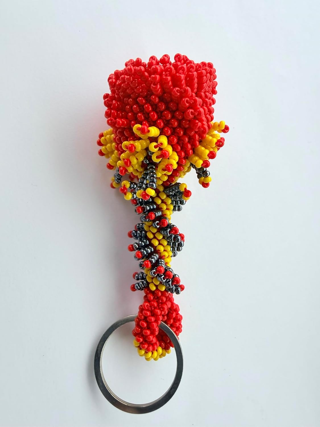vibrant mix of red, yellow, and black glass beads woven