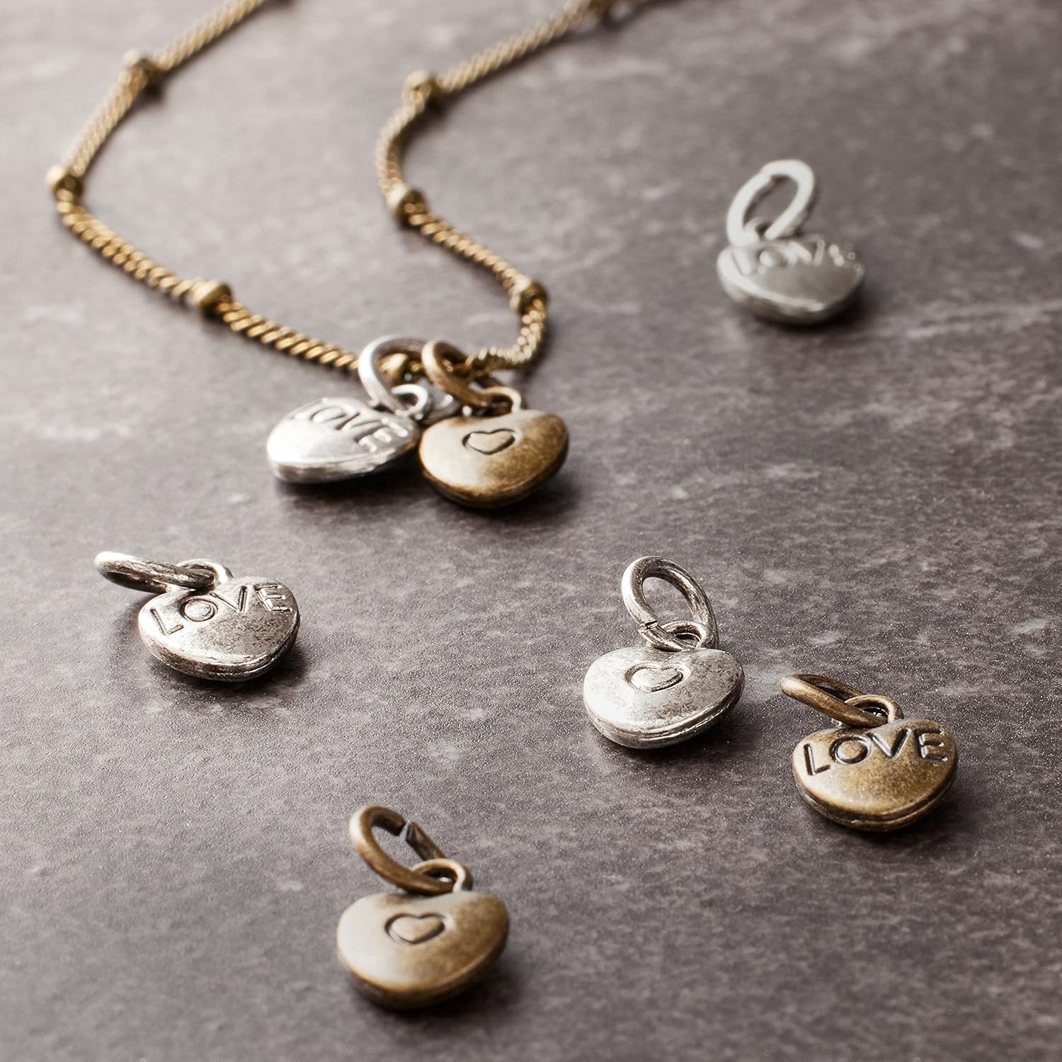 Bead Landing 12 Packs: 25 ct. (300 total) Metal Heart-Shaped Charms