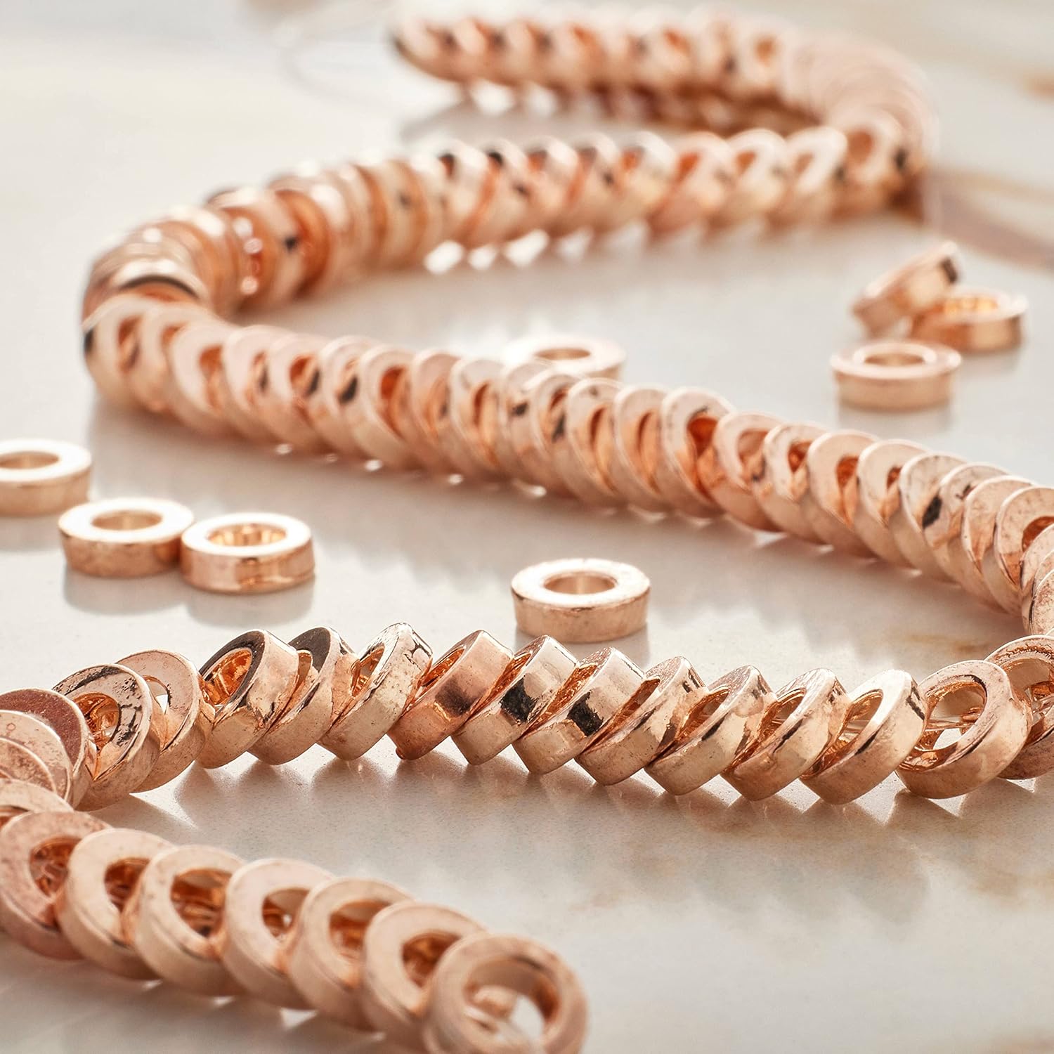 12 Pack: Rose Gold Large Hole Metal Spacer Disc Beads by Bead Landing™