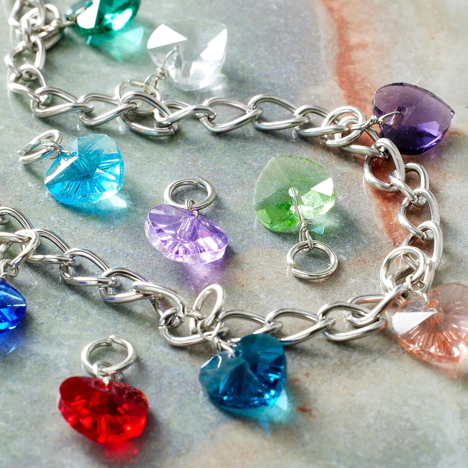 Bead Landing 12 Packs: 12 ct. (144 total) Charmalong™ Multicolored Rhodium Heart Charms