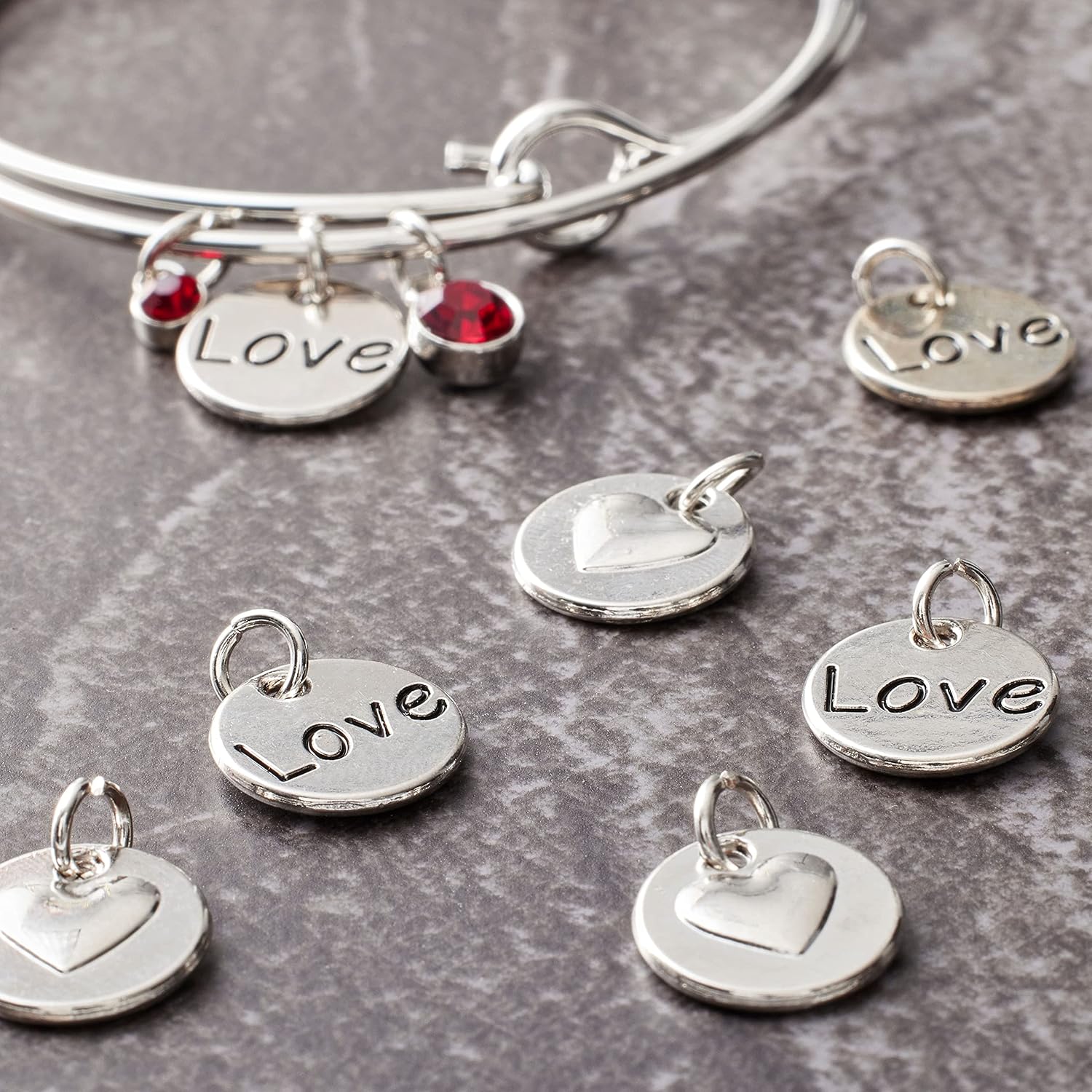 Bead Landing 12 Packs: 12 ct. (144 total) Rhodium-Colored Reverse Heart Charms