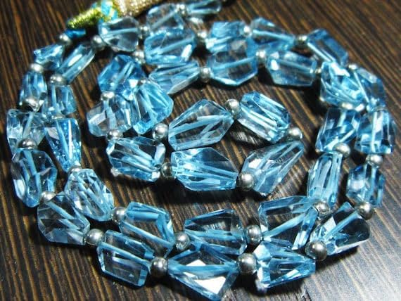 BEADS GEMSTONE 120 carat-AAA Blue Topaz Step Cut Nuggets- 17 Inch Long Strand -Stones measure- 7-11mm long. Code-HIGH-8016