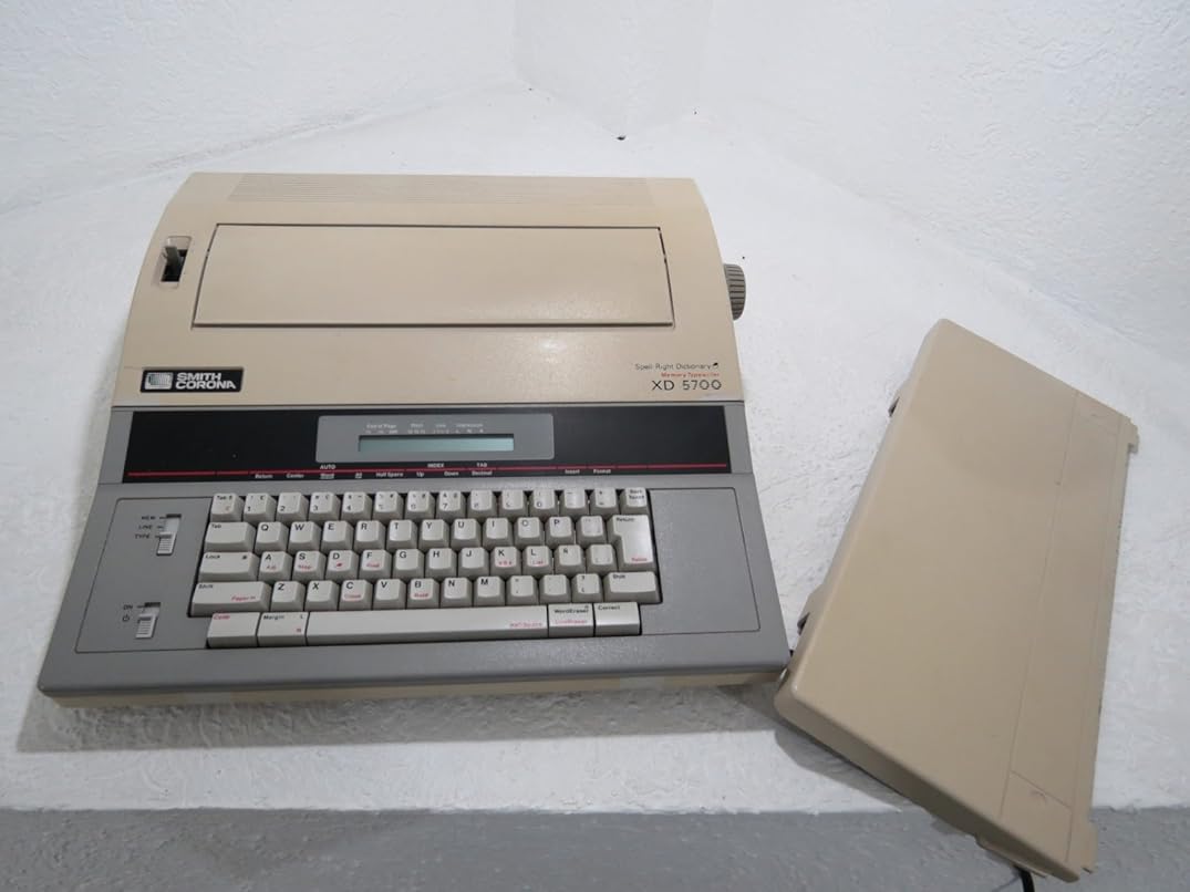 Rebuilt Discontinued Smith Corona XD 5700 Typewriters by Around The Office with New Machine Guarantee, Extra Ribbons & Correction Tapes, and Dust Cover