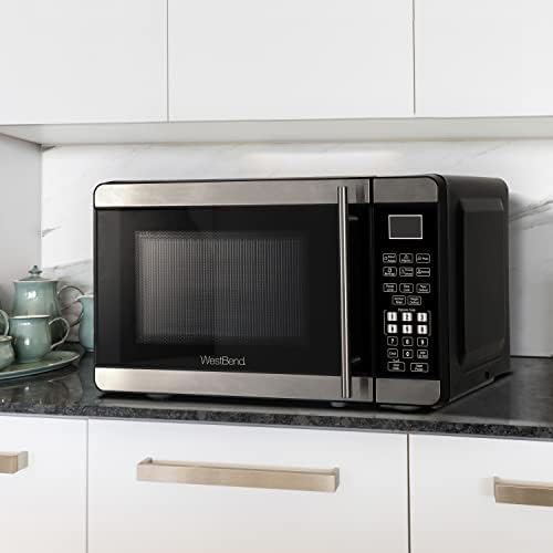 West Bend Microwave Oven 700-Watts Countertop Compact Footprint with 6 Pre Cooking Settings, Speed Defrost, Electronic Control Panel and Glass Turntable Perfect for Small Spaces, 0.7-Cu.Ft., Metallic