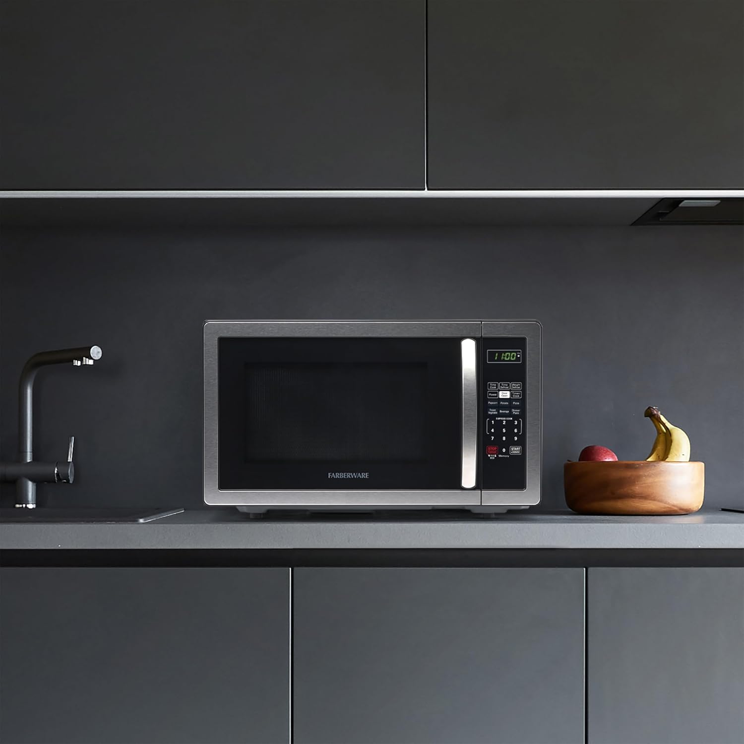 Farberware 1.1 Cu. Ft. Countertop Microwave Oven – 1000 Watts Power, Auto Cook Settings, Defrost, Easy Clean and Child Safety Lock - Stainless