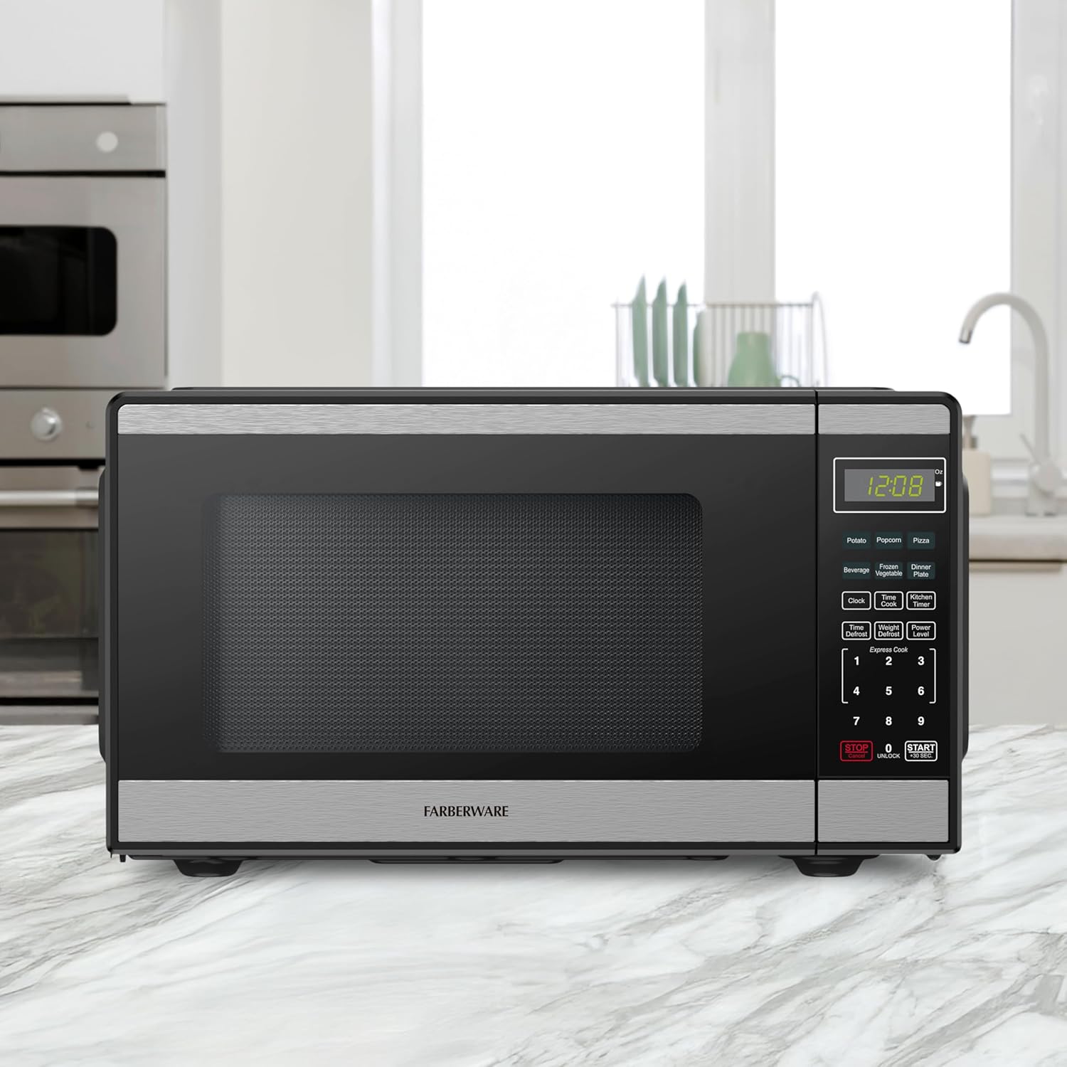 Farberware 0.9 Cu. Ft Countertop Microwave Oven - 900 Watts Power, Auto Cook Settings, Defrost, Easy Clean and Child Safety Lock - Stainless