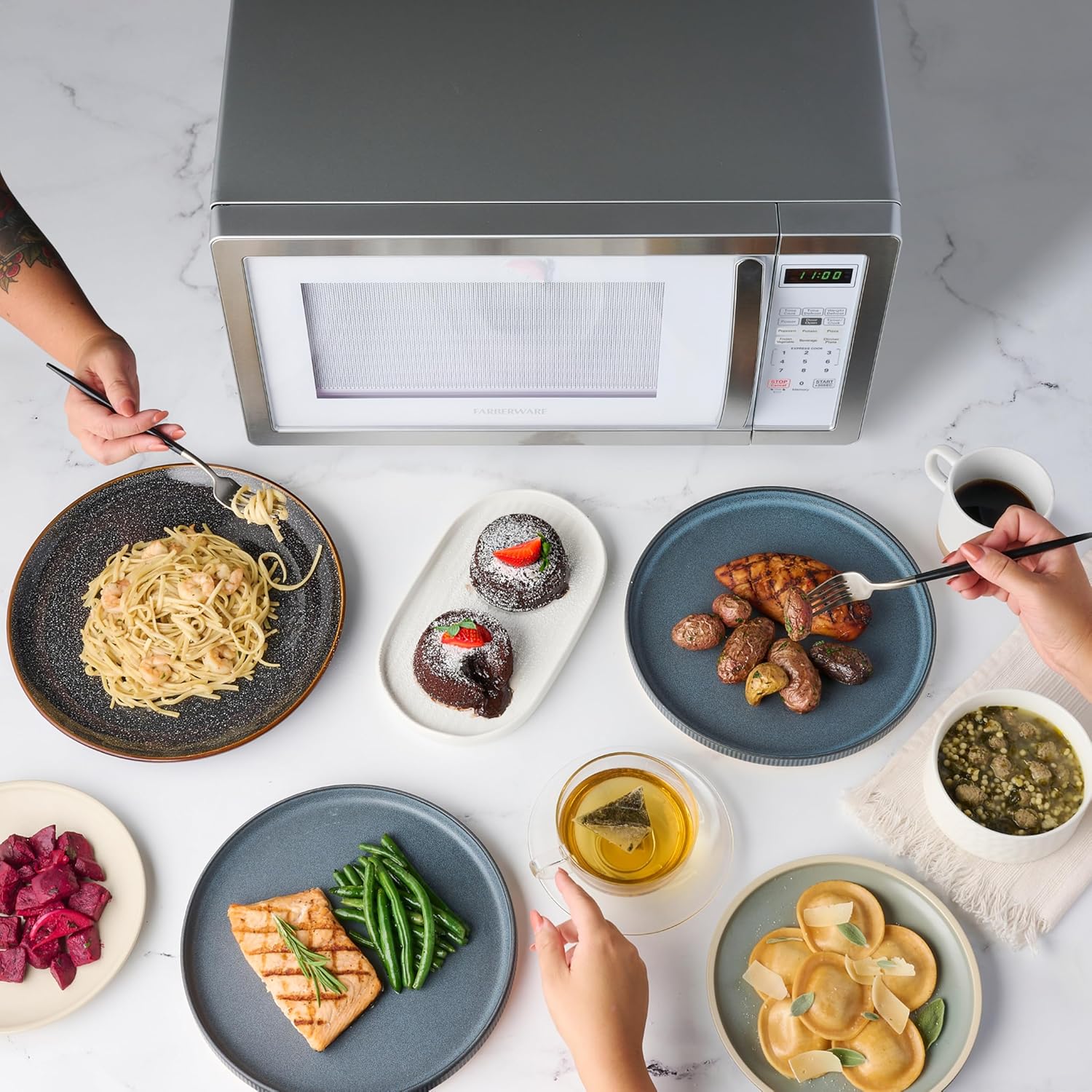 Farberware 1.1 Cu. Ft. Countertop Microwave Oven – 1000 Watts Power, Auto Cook Settings, Defrost, Easy Clean and Child Safety Lock - White Platinum