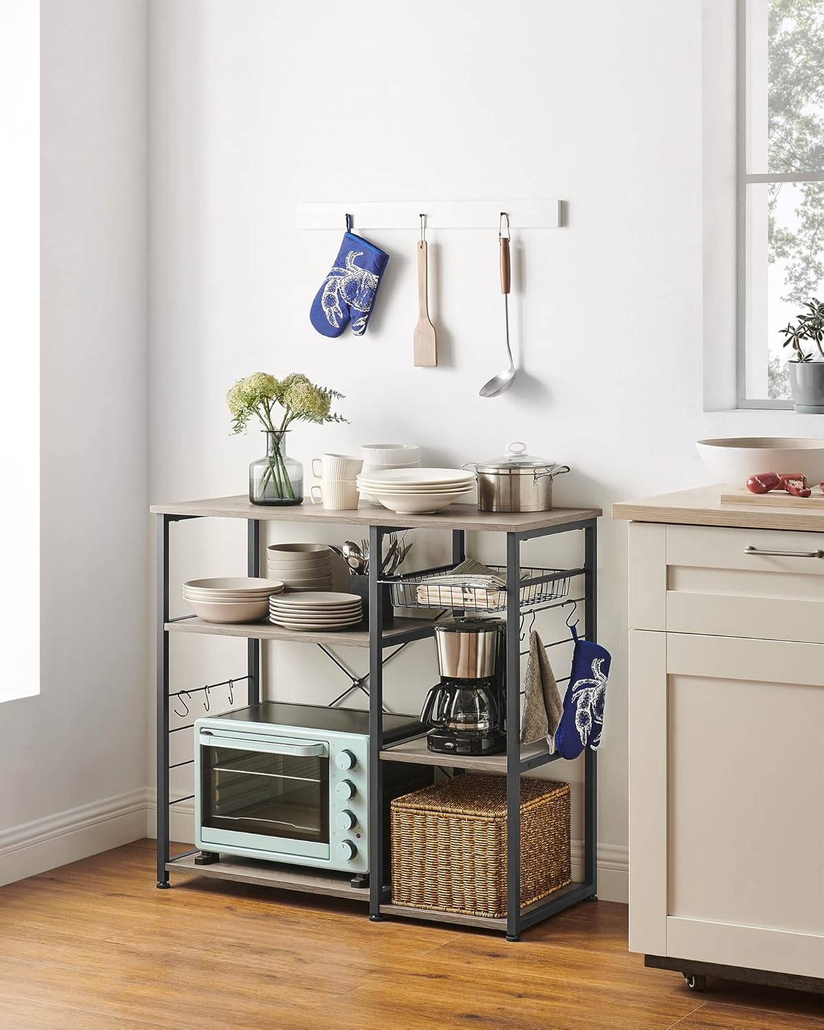 VASAGLE ALINRU Kitchen Baker’s Rack, Coffee Bar, Microwave Oven Stand, with Steel Frame, Wire Basket, 6 Hooks, for Mini Oven, Spices Utensils, Industrial, Heather Greige and Ink Black UKKS090B02