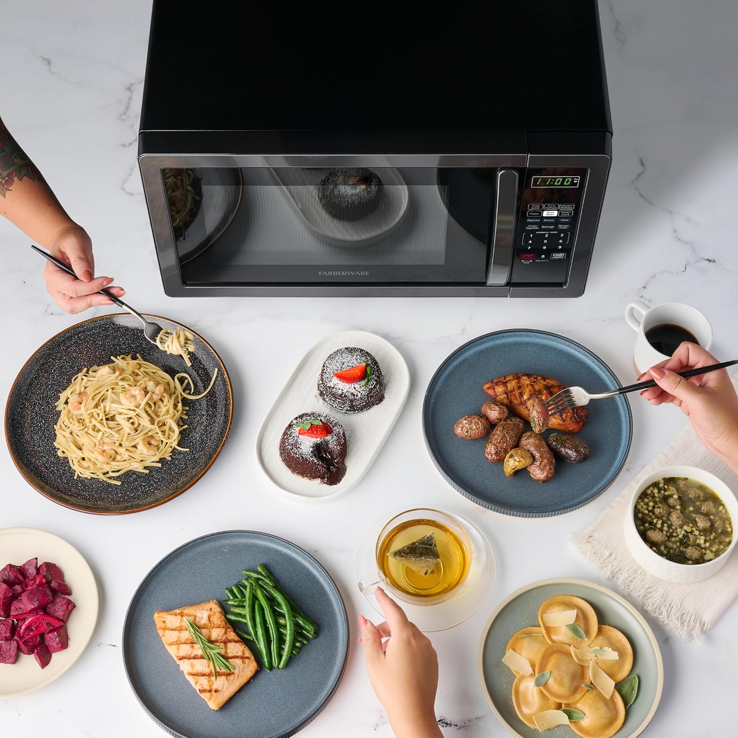 Farberware 1.1 Cu. Ft. Countertop Microwave Oven – 1000 Watts Power, Auto Cook Settings, Defrost, Easy Clean and Child Safety Lock - Stainless and Black