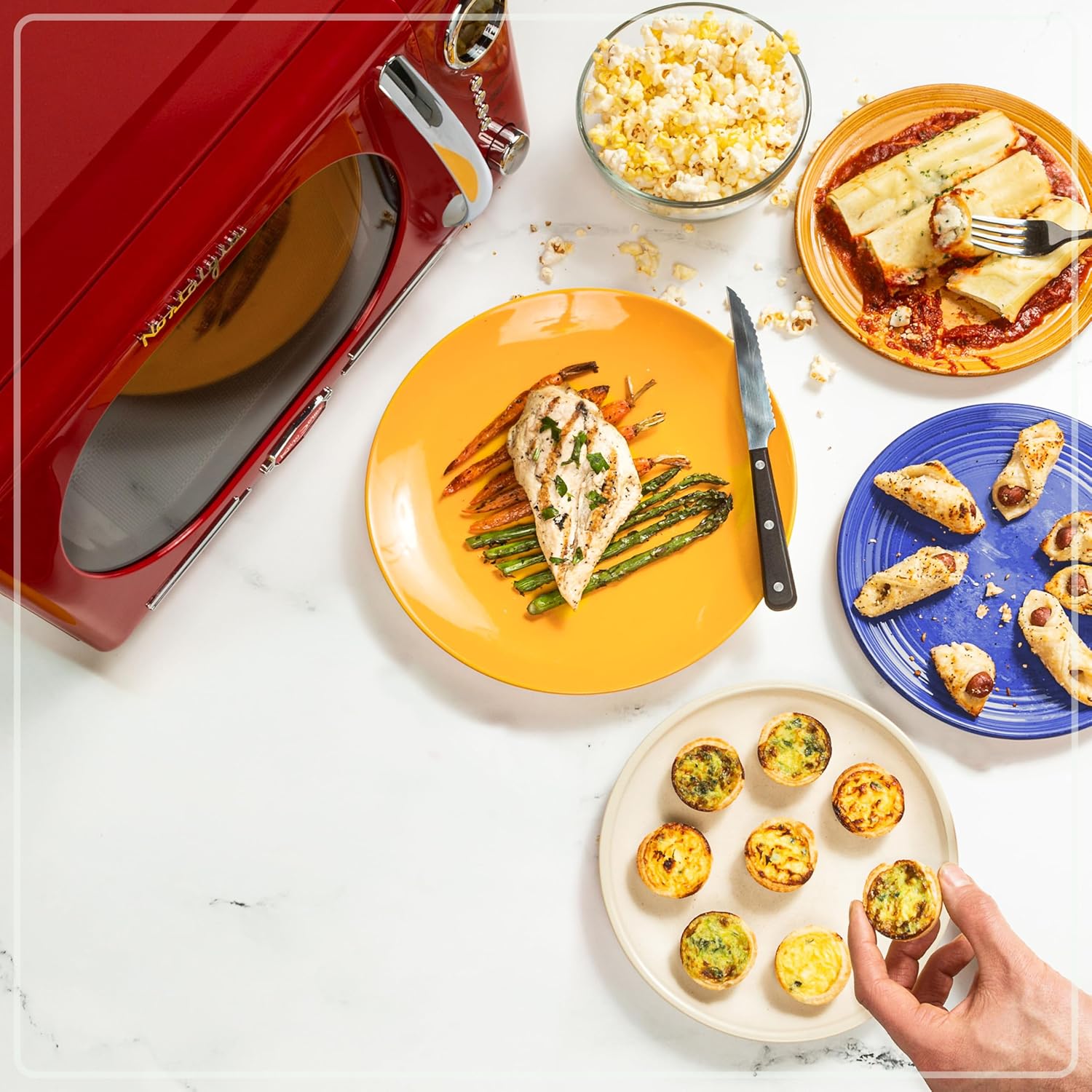 Nostalgia Retro Countertop Microwave Oven - 1.1 Cu Ft & 1000 Watt Power- Easy to Clean with Removable Glass Turntable - Child Safety Lock - 12 Programs - Digital Clock - Red