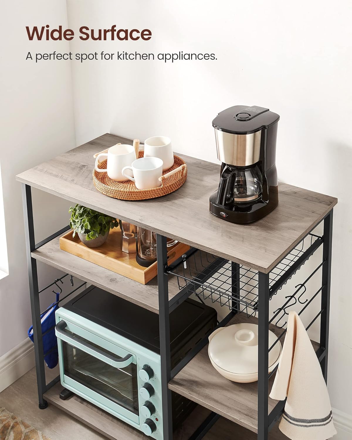 VASAGLE ALINRU Kitchen Baker’s Rack, Coffee Bar, Microwave Oven Stand, with Steel Frame, Wire Basket, 6 Hooks, for Mini Oven, Spices Utensils, Industrial, Heather Greige and Ink Black UKKS090B02